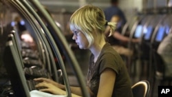 A Muscovite surfs a Web site at an Internet cafe in downtown Moscow (2006 file)