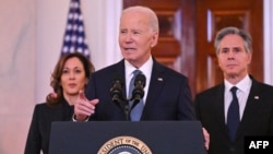 US President Joe Biden, alongside Vice President Kamala Harris (L) and Secretary of State Antony Blinken (R), speaks about the Israel-Hamas ceasefire and hostage release deal in the Grand Foyer of the White House on January 15, 2025.