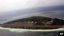 FILE - An aerial view shows Pag-asa Island, part of the disputed Spratly group of islands, in the South China Sea located off the coast of western Philippines, July 20, 2011.