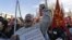 A protester wearing a sign reading "unemployed" shouts slogans during a metalworkers protest in front of the Duomo gothic cathedral, in Milan, Italy, December 5, 2012.
