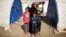 Displaced Iraqi Orouba Abdelhamid, 31, poses for a photograph with her children at Hammam al-Alil camp south of Mosul, Iraq, April 1, 2017. Abdelhamid's husband, an engineer, was killed in a rocket strike as government forces arrived to expel Islamic State from her home city Mosul. "No one is left for me over there so I came here... I cannot return to the house," she said.