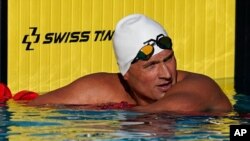 FILE - In this April 8, 2021, file photo, Ryan Lochte pauses after competing in the men's 200-meter freestyle preliminary race at the TYR Pro Swim Series swim meet in Mission Viejo, Calif.
