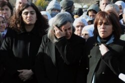 FILE - Several hundred Turkish Kurds, including lawmaker Gultan Kisanak, center, gather to protest the killings of three Kurdish women in Paris, in the southeastern Turkish city of Diyarbakir, Jan. 10, 2013.