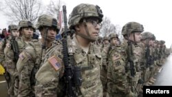 FILE - U.S. troops military troops line up in November 2015. Authorities say two Afghan men getting military training in the United States are missing.