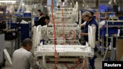 Workers assemble hospital beds in Linet factory in Slany, Czech Republic, Feb. 7, 2017. Zbynek Frolik, 63, founded Linet in 1990 and now employs 900 people making hospital beds. Frolik gave up leading the company on a daily basis, but still has a 33 percent stake in the business. 