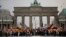 AfD supporters wave flags in front of the Brandenburg Gate in Berlin, Germany, May 27, 2018. The AfD swept into Parliament last year on a wave of anti-migrant sentiment.