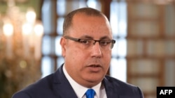 FILE - Hichem Mechichi, who until now has served as Tunisia's interior minister, has been appointed to form the next government, the president's office said, July 25, 2020. 