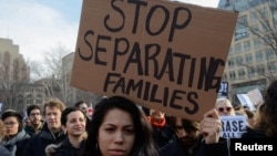 People participate in a protest against President Donald Trump's immigration policy and the recent Immigration and Customs Enforcement raids in New York City, Feb. 11, 2017.