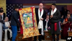 FILE - U.S. Representative Jim McGovern, part of a U.S. delegation, is presented with a traditional Tibetan Buddhist painting at a public event in Dharamshala, India, on June 19, 2024. McGovern on Aug. 2 said he would wear Chinese sanctions against him "as a badge of honor."