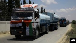 Egyptian trucks carrying fuel enter Gaza's power plant in Nusseirat, in the central Gaza Strip, June 21, 2017.