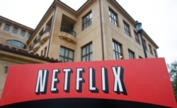 FILE - This Jan. 29, 2010, photo shows the company logo and view of Netflix headquarters in Los Gatos, Calif.