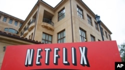 FILE - This Jan. 29, 2010, file photo shows the company logo and view of Netflix headquarters in Los Gatos, Calif. 