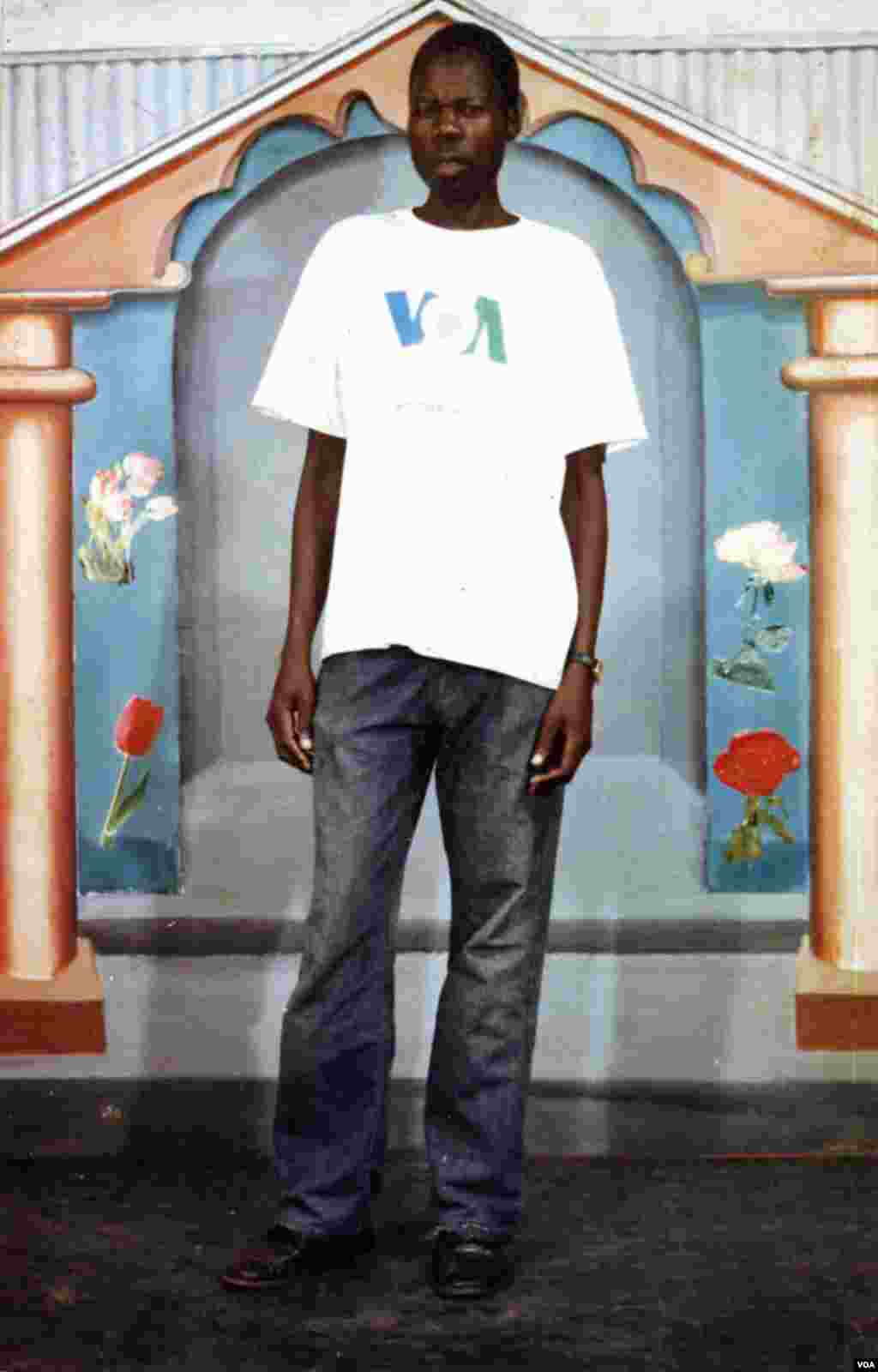 John Bosco Komanakech shows off his new VOA shirt in Gulu, Uganda.