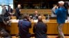 Greek Finance Minister Yanis Varoufakis, center, is photographed during a round table meeting of European Union finance ministers at the European Council building in Luxembourg, June 19, 2015. 