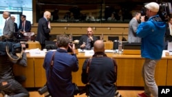 Greek Finance Minister Yanis Varoufakis, center, is photographed during a round table meeting of European Union finance ministers at the European Council building in Luxembourg, June 19, 2015. 