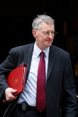 Hilary Benn leaves 10 Downing Street in London after a meeting, June 12, 2009.