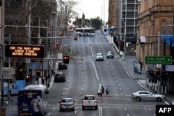 A general view shows quiet streets in the central business district of Sydney, Aug. 14, 2021, as Australia's biggest city announced tighter Covid restrictions including heavier fines and tighter policing to contain a Delta outbreak.