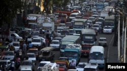 Cars are held up in a traffic jam in downtown Cairo, September 2013.