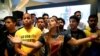 Supporters of Venezuela's coalition of opposition parties (MUD) react to results of gubernatorial elections, at campaign headquarters in Caracas, Oct. 15, 2017.