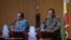 FILE - Lieutenant-General Bacha Debele of the Ethiopian National Defense Force, right, gives a joint press conference with State Minister of Foreign Affairs Redwan Hussein, in Addis Ababa, Ethiopia, June 30, 2021.