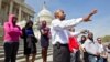 FILE - Senate Chaplain Barry Black leads Congressional staff members and others in prayer .