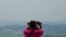 A visitor views the North Korea side from the Unification Observation Post in Paju South Korea, near the border with North Korea, Thursday, June 17, 2021. The North Korea's official Korean Central News Agency said Wednesday, June 16, 2021, that…