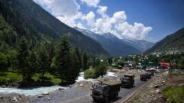 An Indian army convoy moves on the Srinagar- Ladakh highway at Gagangeer, north-east of Srinagar, India, June 17, 2020.