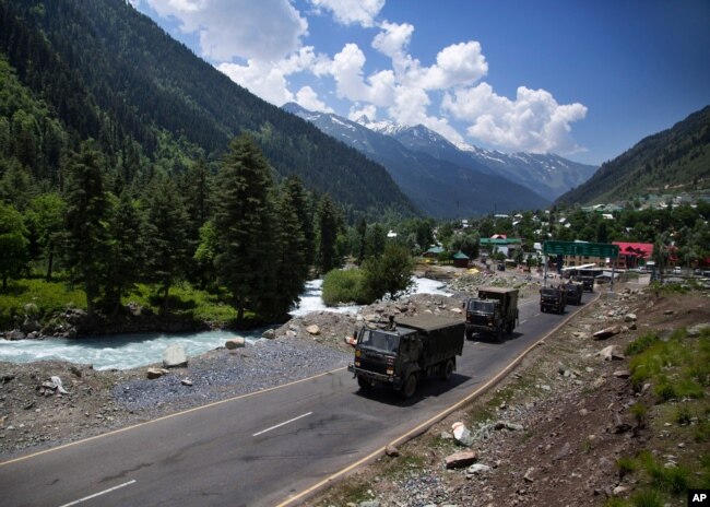 An Indian army convoy moves on the Srinagar- Ladakh highway at Gagangeer, north-east of Srinagar, India, June 17, 2020.