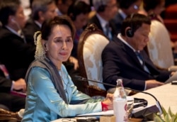 FILE - Myanmar leader Aung San Suu Kyi participates in the ASEAN-Japan summit in Nonthaburi, Thailand, Nov. 4, 2019.