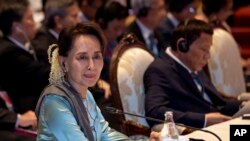 Myanmar leader Aung San Suu Kyi participates in the ASEAN-Japan summit in Nonthaburi, Thailand, Monday, Nov. 4, 2019. (AP Photo/Gemunu Amarasinghe)