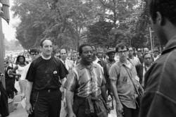 Civil rights leader Rev. Ralph Abernathy, center, is shown as he leads the Poor People's March toward the Capitol in Washington, June 24, 1968.