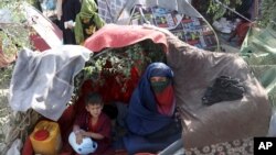 Internally displaced Afghans from northern provinces, who fled their home due to fighting between the Taliban and Afghan security personnel, take refuge in a public park Kabul, Afghanistan, Aug. 13, 2021. 