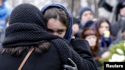 Zhanna, daughter of Russian leading opposition figure Boris Nemtsov, reacts during his funeral in Moscow, March 3, 2015. 