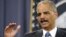 Attorney General Eric Holder gestures during a news conference at the Justice Department in Washington, April 11, 2012.