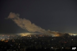 Asap mengepul dari lokasi serangan udara Israel di Dahiyeh, Beirut, Lebanon, Jumat, 25 Oktober 2024. (Hassan Ammar/AP)