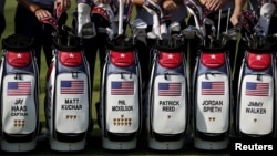 U.S. team members pose for group photo before the start of the first round of the 2015 Presidents Cup golf tournament at The Jack Nicklaus Golf Club in Incheon, South Korea, October 6, 2015. 