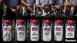 U.S. team members pose for group photo before the start of the first round of the 2015 Presidents Cup golf tournament at The Jack Nicklaus Golf Club in Incheon, South Korea, October 6, 2015. 