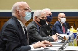 From left to right, Dr. Robert Redfield, Dr. Anthony Fauci, ADM Brett P. Giroir and Dr. Stephen M. Hahn testify before a House Committee on Energy and Commerce on the Trump administration's response to the COVID-19 pandemic, June 23, 2020.