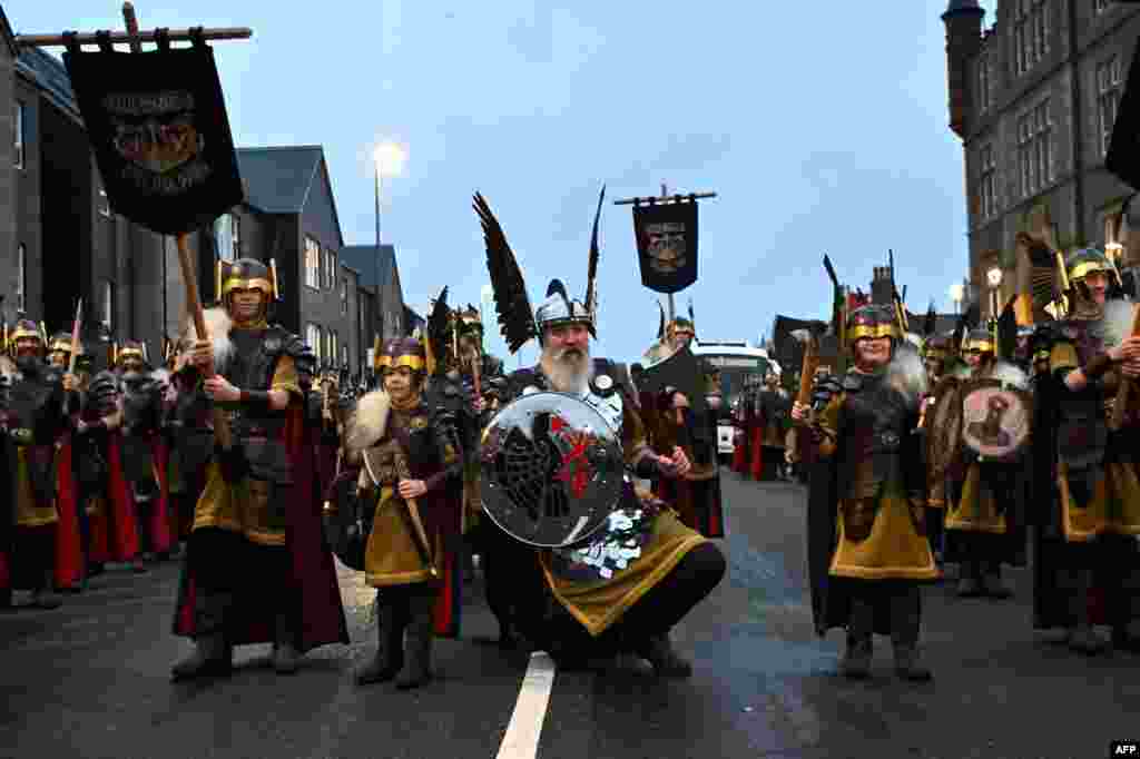 Members of the Up Helly Aa &#39;Jarl Squad&#39; parade through the streets of Lerwick, Shetland Islands, before the Up Helly Aa festival later in the day.