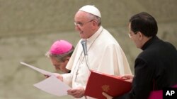 Pope Francis delivers his speech during a special audience with participants of the "World Congress of Accountants ", in the Paul VI Hall at the Vatican, Friday, Nov. 14, 2014.