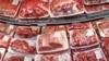 FILE - In this Nov. 2, 2013, photo, various cuts of beef and pork are displayed for sale in the meat department at a discount market in Arlington, Va. 