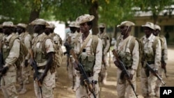 FILE - Chadian troops participate in the closing ceremony of operation Flintlock in an army base in N'Djamena, Chad, March 9, 2015. 