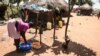 FILE - A South Sudanese refugee washes clothes at the Bidibidi refugee settlement in the Northern District of Yumbe, Uganda, Nov. 26, 2017. 