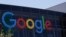 FILE - This July 19, 2016, file photo shows the Google logo at the company's headquarters in Mountain View, Calif. 