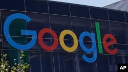 FILE - This July 19, 2016, file photo shows the Google logo at the company's headquarters in Mountain View, Calif. 