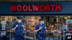 German police officers guard the crime scene in central Wuerzburg, Germany, Saturday, June 26, 2021. German police say several people have been killed and others injured in a knife attack in the southern city of Wuerzburg on Friday.(AP Photo/Michael…