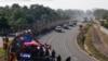 Central American migrants walk in Ciudad Hidalgo, Mexico, Jan. 23, 2020. 