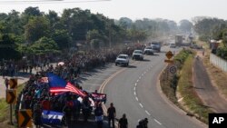 Central American migrants walk in Ciudad Hidalgo, Mexico, Jan. 23, 2020. 