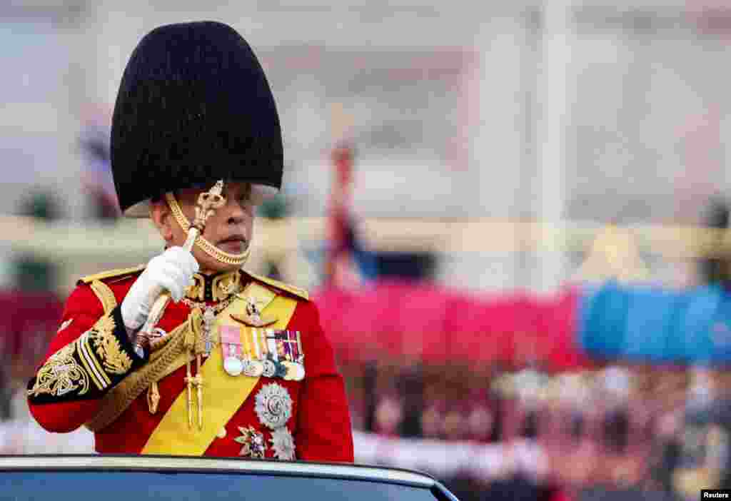 Thailand&#39;s King Maha Vajiralongkorn reviews the guard of honour, during a trooping of the colours ceremony to honor his 72nd birthday in Bangkok, Thailand.