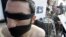 FILE - Syrian opposition members take part in a demonstration calling for more human rights in Syria, including putting a stop to physical torture in prisons, Beirut, Lebanon.